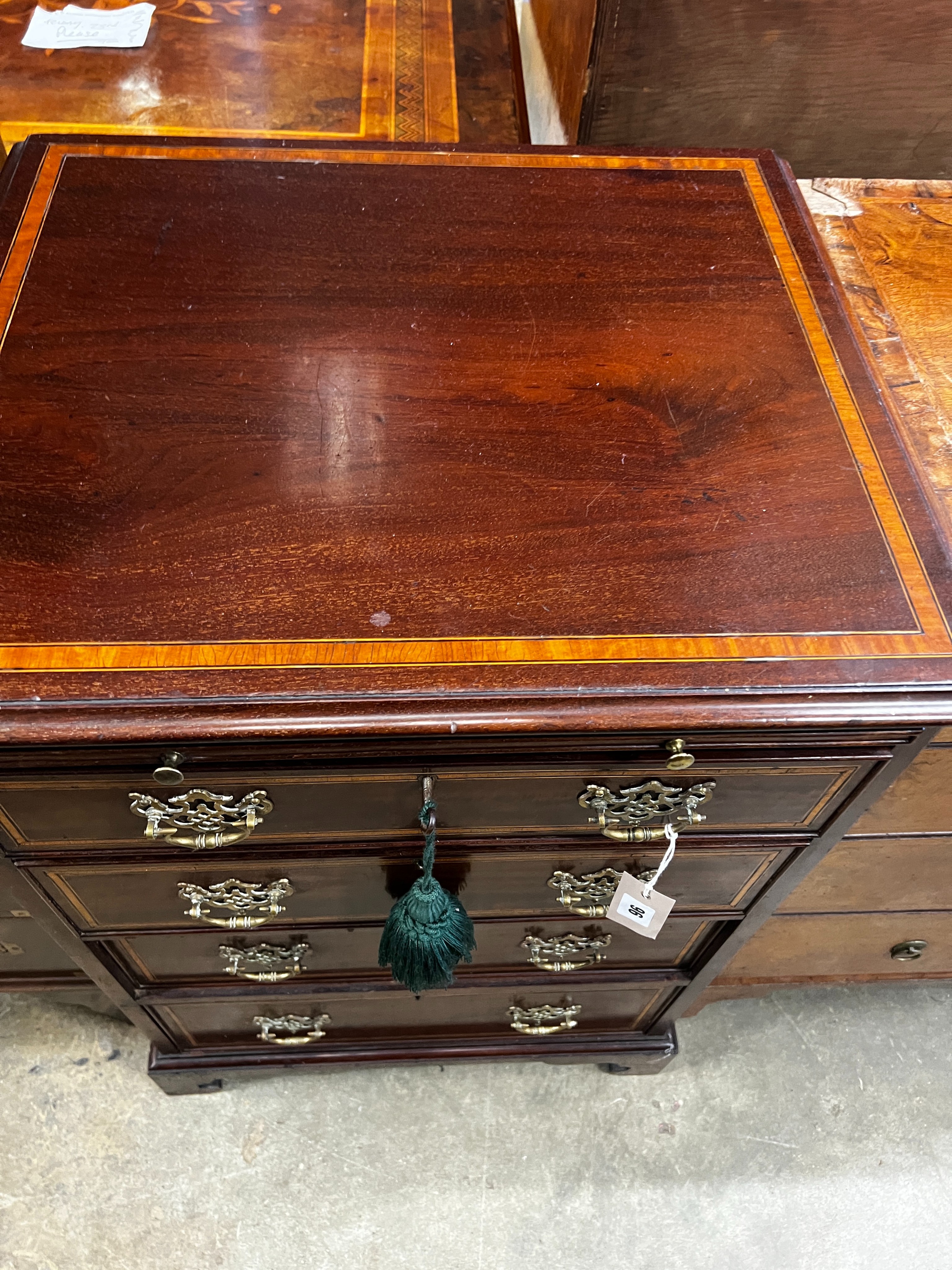 A small George III style satinwood banded mahogany four drawer chest fitted slide, width 56cm, depth 48cm, height 82cm